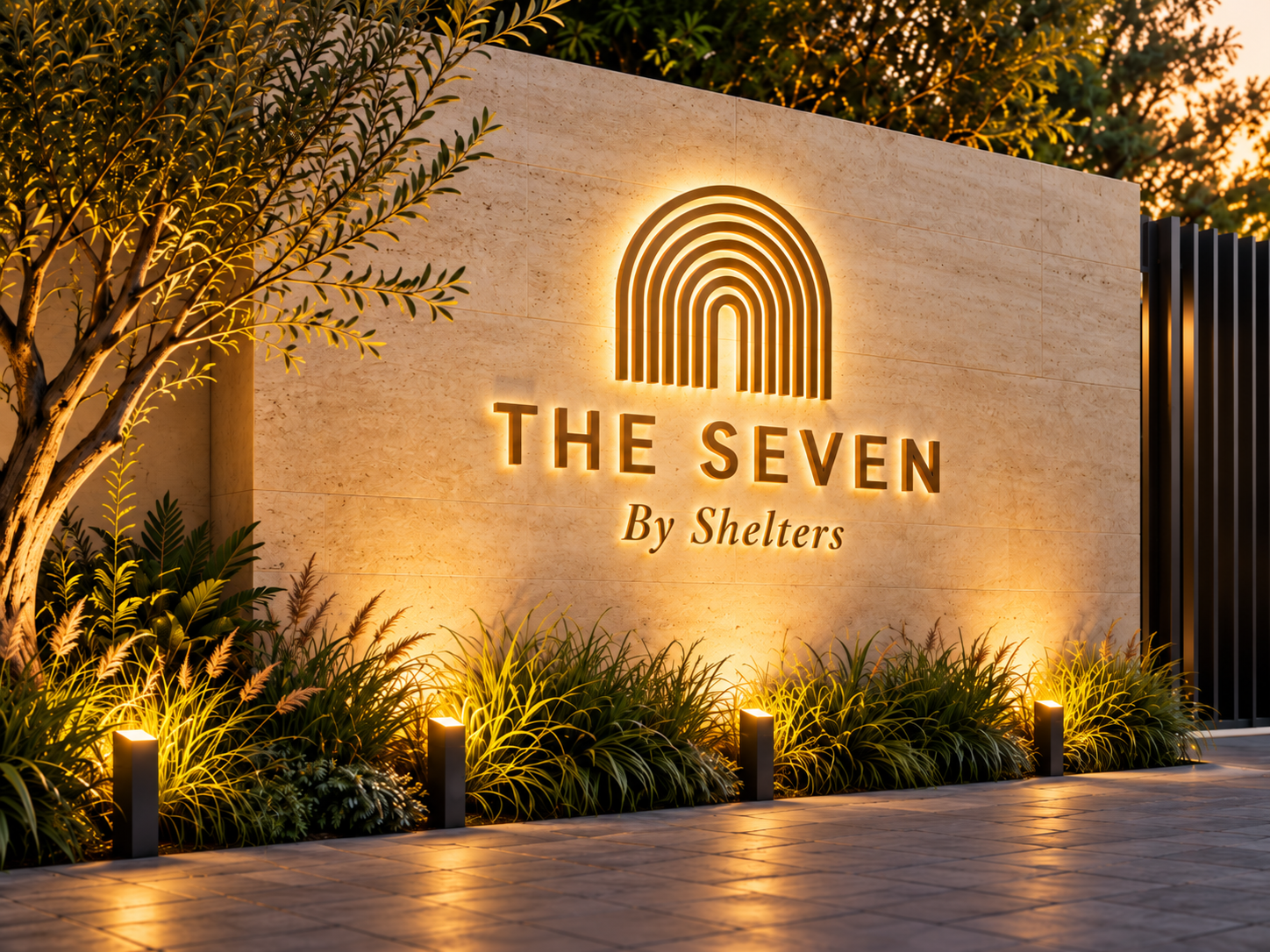 The Seven by Shelters illuminated entrance wall with landscaped planting